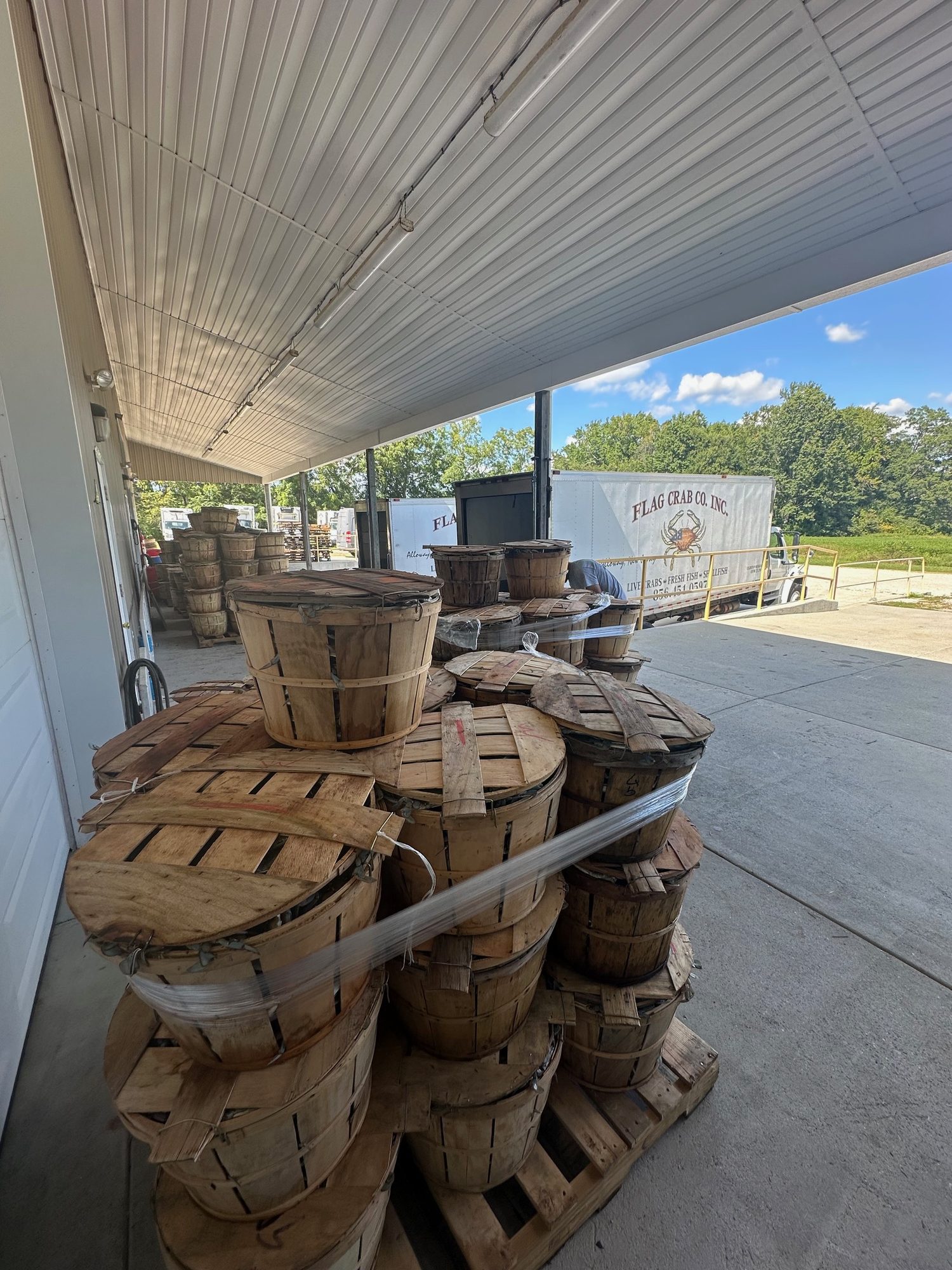 Bushels stacked at the dock with the Flag Crab truck beyond