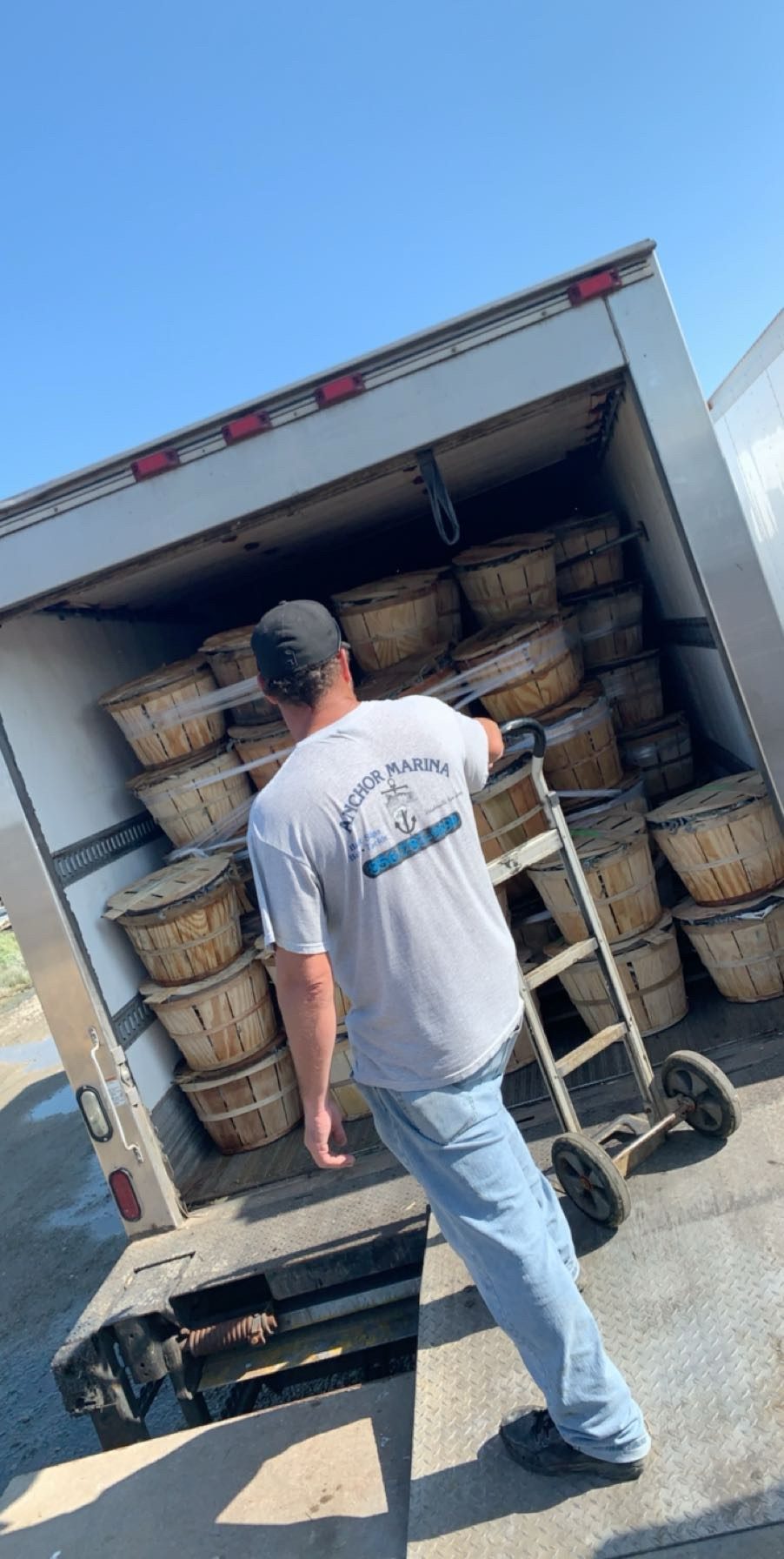 Crew loading live crabs onto the Flag Crab truck